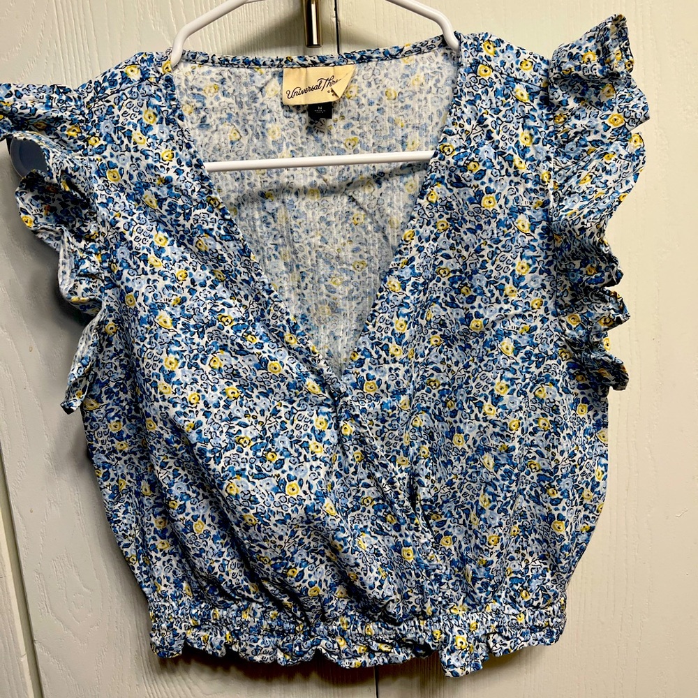 Floral sleeveless top with shoulder ruffles